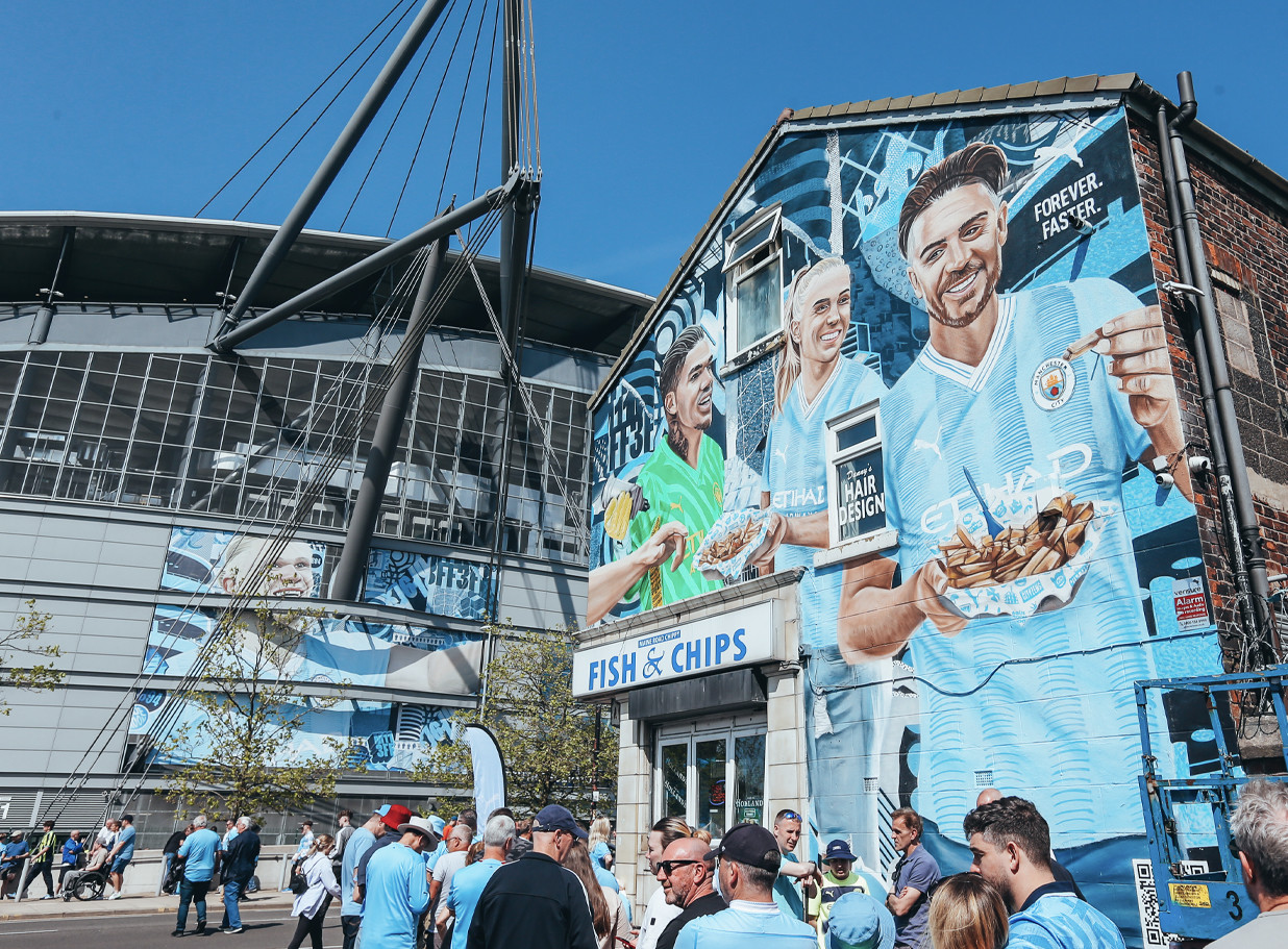 City player's mural on top of a fish and chips shop.