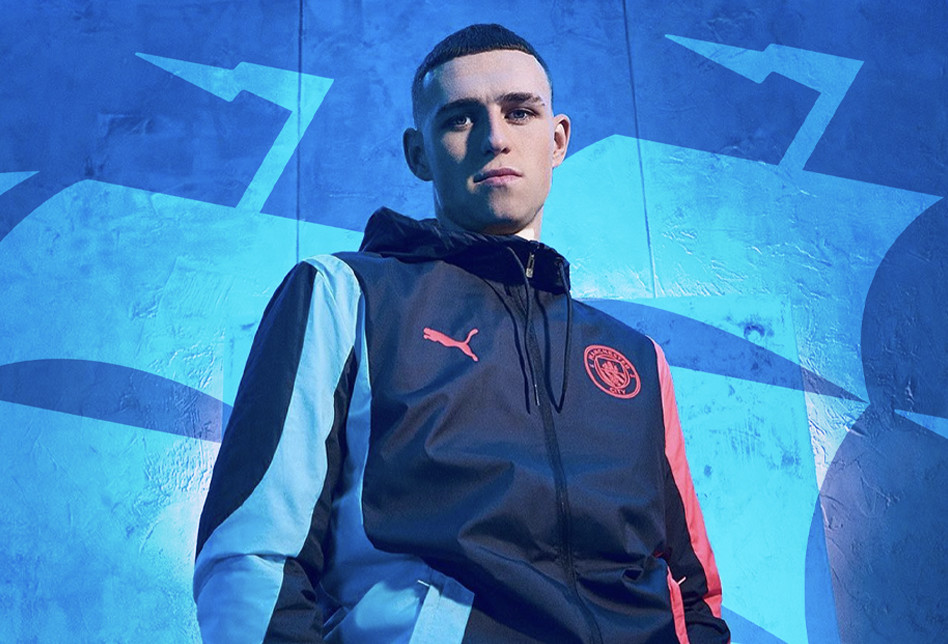 Phil Foden posing in front of City ship.